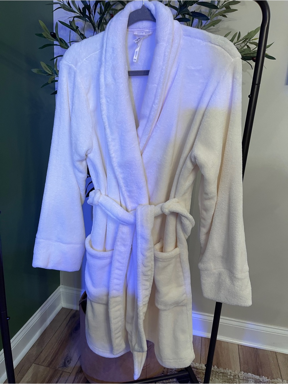 Women's white fluffy jacket interior with label